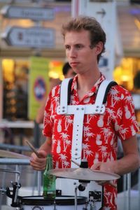 Portrait of young man playing drum