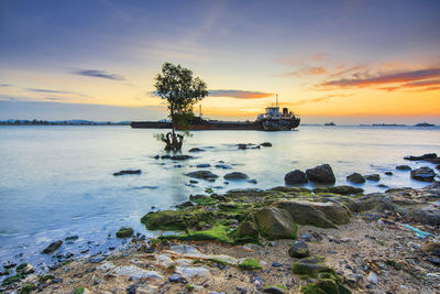 Scenic view of sea against sky during sunset