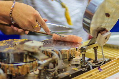 Cropped hands making food