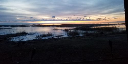 Scenic view of sea against sky at sunset