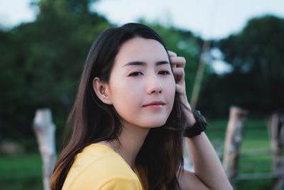 Portrait of a beautiful young woman outdoors