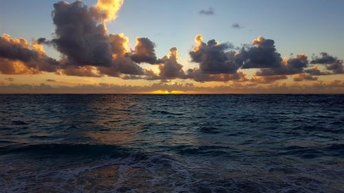 Scenic view of sea against sky at sunset