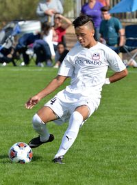 Man playing soccer on field