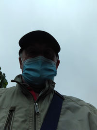 Low angle view of man against clear sky