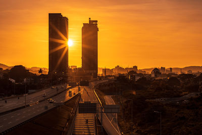 High angle view of buildings against sky during sunset