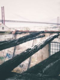 Close-up of metal fence against sky