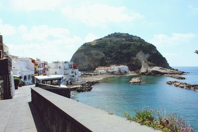 Panoramic view of sea and buildings against sky