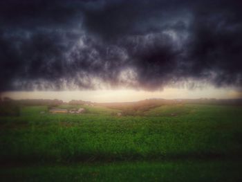 Scenic view of landscape against cloudy sky