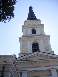 Low angle view of clock tower against sky