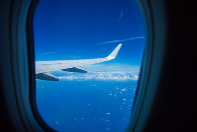 Airplane wing seen through window