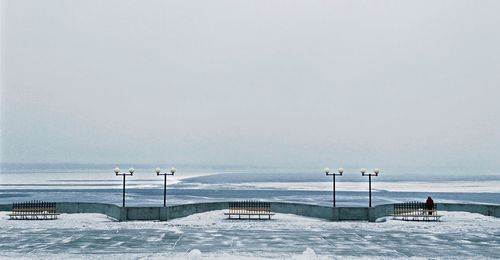 Scenic view of frozen lake against cloudy sky