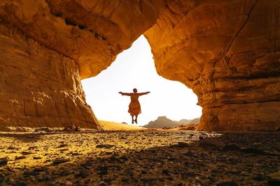 Woman standing on rock formation