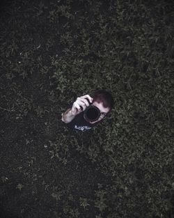 High angle view portrait of girl on plant