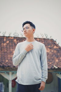 Young man standing outdoors