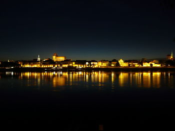 Reflection of illuminated buildings in water