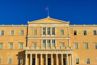 Low angle view of building against clear blue sky