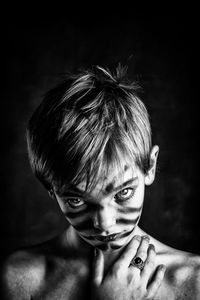 Portrait of teenager boy with face paint