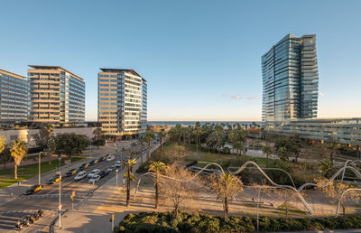 Buildings in city against clear sky