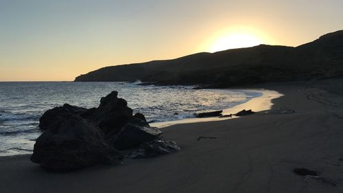 Scenic view of sea against sky at sunset