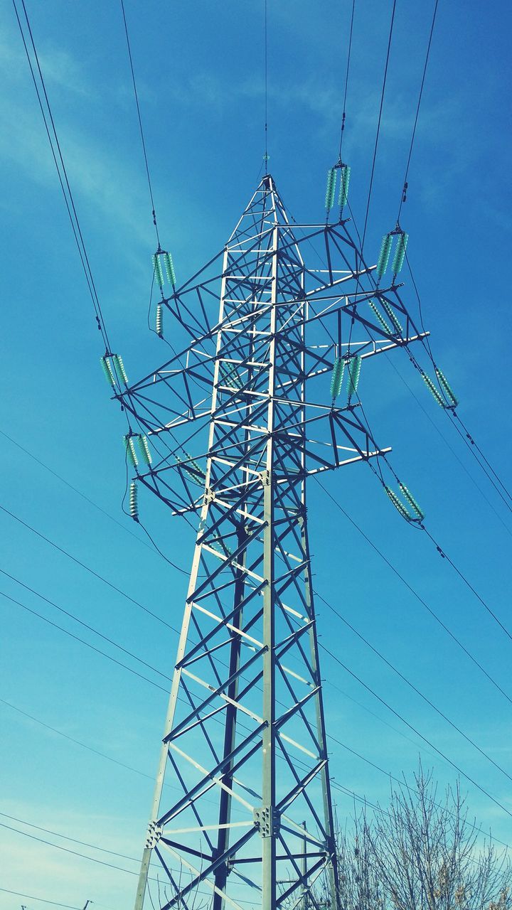 low angle view, power line, electricity pylon, electricity, power supply, sky, blue, connection, cable, technology, silhouette, fuel and power generation, tall - high, tower, bare tree, built structure, day, outdoors, no people, clear sky