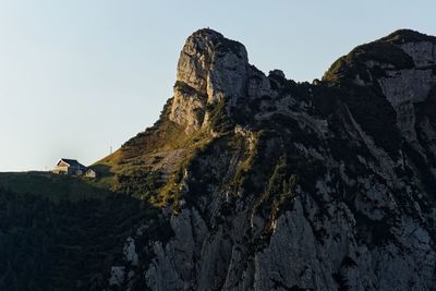 Low angle view of rock formation against clear sky