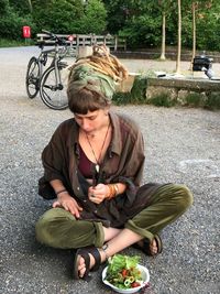 Full length of woman sitting in bus