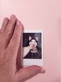Portrait of man holding dog
