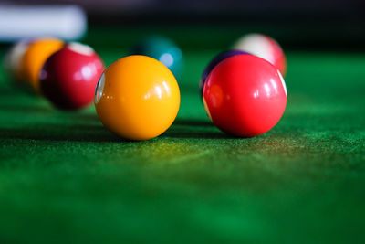 Close-up of multi colored balls on table