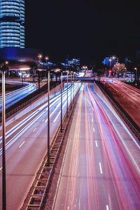 Light trails on road in city at night