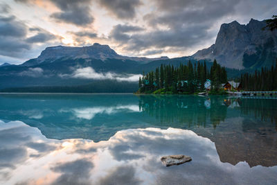 Scenic view of lake and mountains against sky