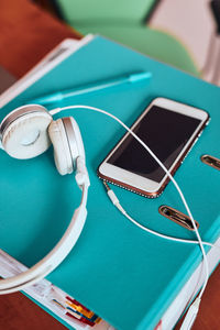 High angle view of smart phone on table