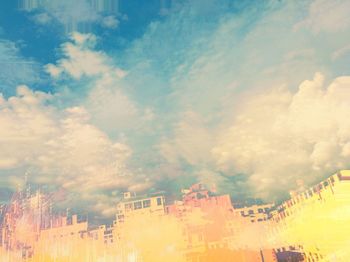 View of buildings against cloudy sky