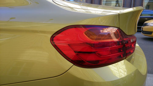 Close-up of red car on beach