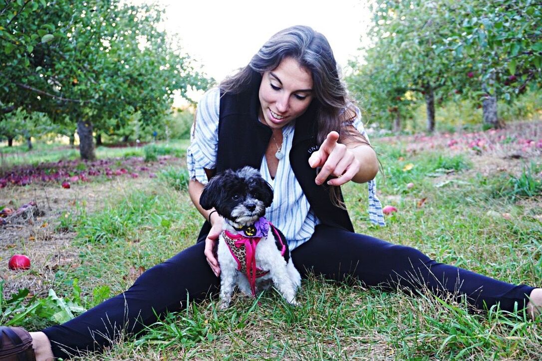 YOUNG WOMAN WITH DOG