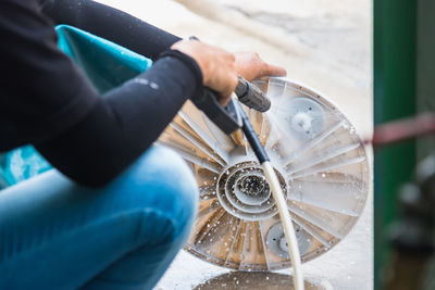 Close-up of man working on machine