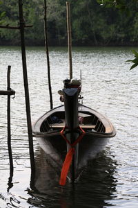 Boat in river against sky