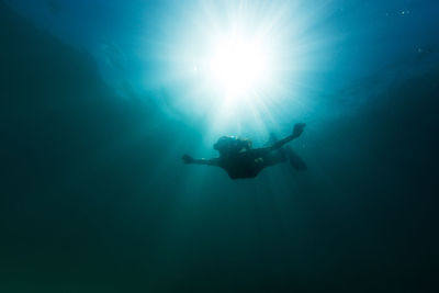 Low angle view of person swimming in sea