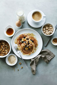 Whole wheat blueberry walnut banana pancakes with granola and coffee