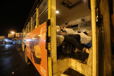 View of train in city at night