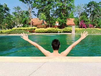 Rear view of woman in swimming pool