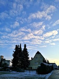 Houses against sky during winter
