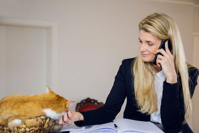 Portrait of woman using phone