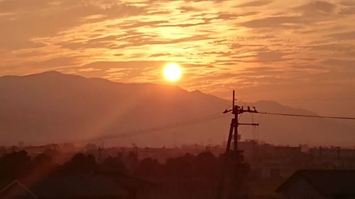 Silhouette mountain against sky during sunset