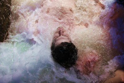 Portrait of shirtless man in water