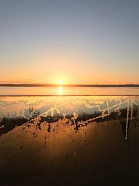 Scenic view of lake against sky during sunset