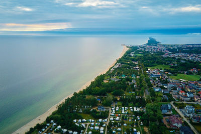 Sea landscape with sandy beach and jastarnia city on hel peninsula. baltic sea coast in poland