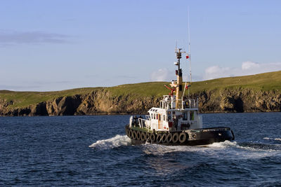 Tug vessel at the coastline