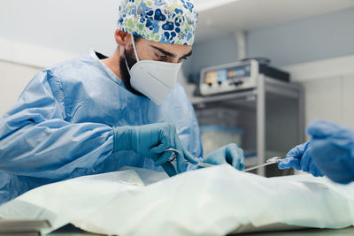 Midsection of man wearing mask