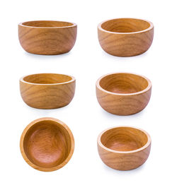 Montage of wooden bowls against white background