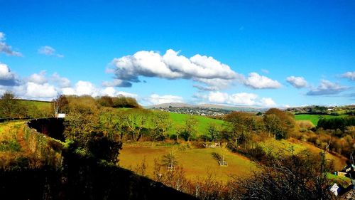 Scenic view of landscape against cloudy sky